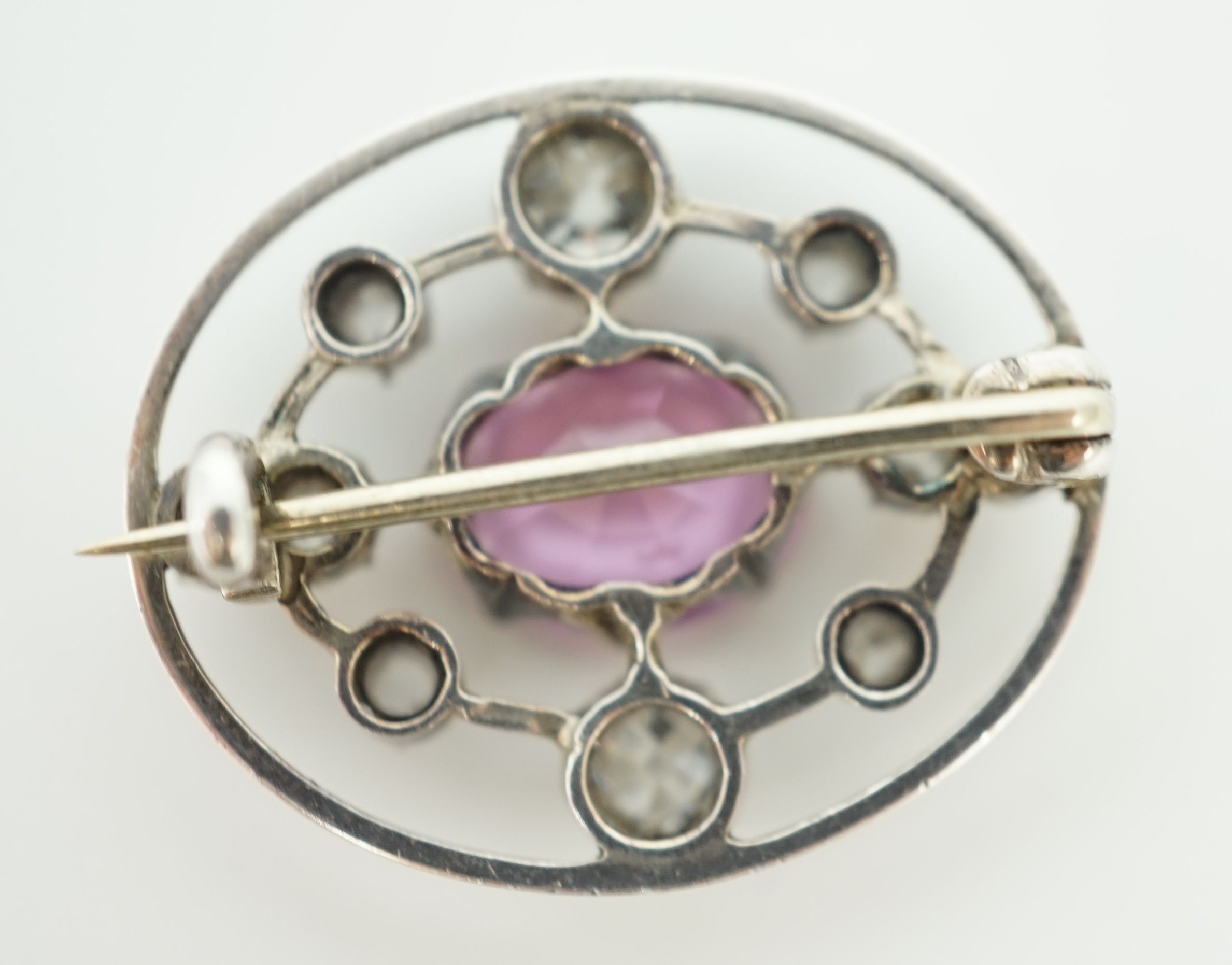 A 19th century gold and silver, pink topaz and diamond set openwork oval brooch